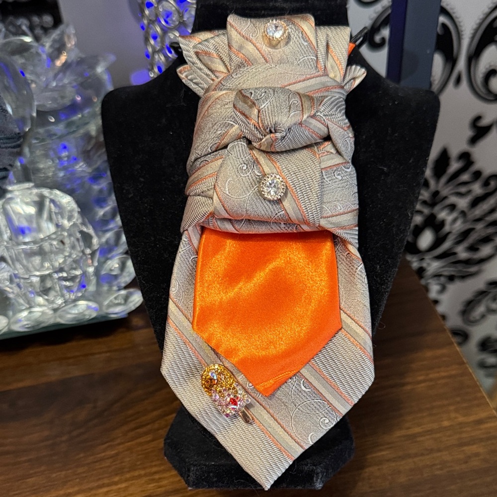Elegant Orange and Gray Necktie with Brooches
